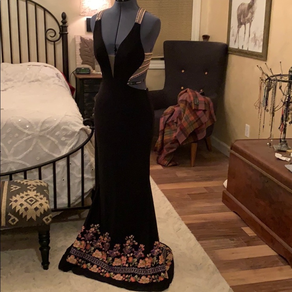 Black prom or formal dress with  embroidered hem.